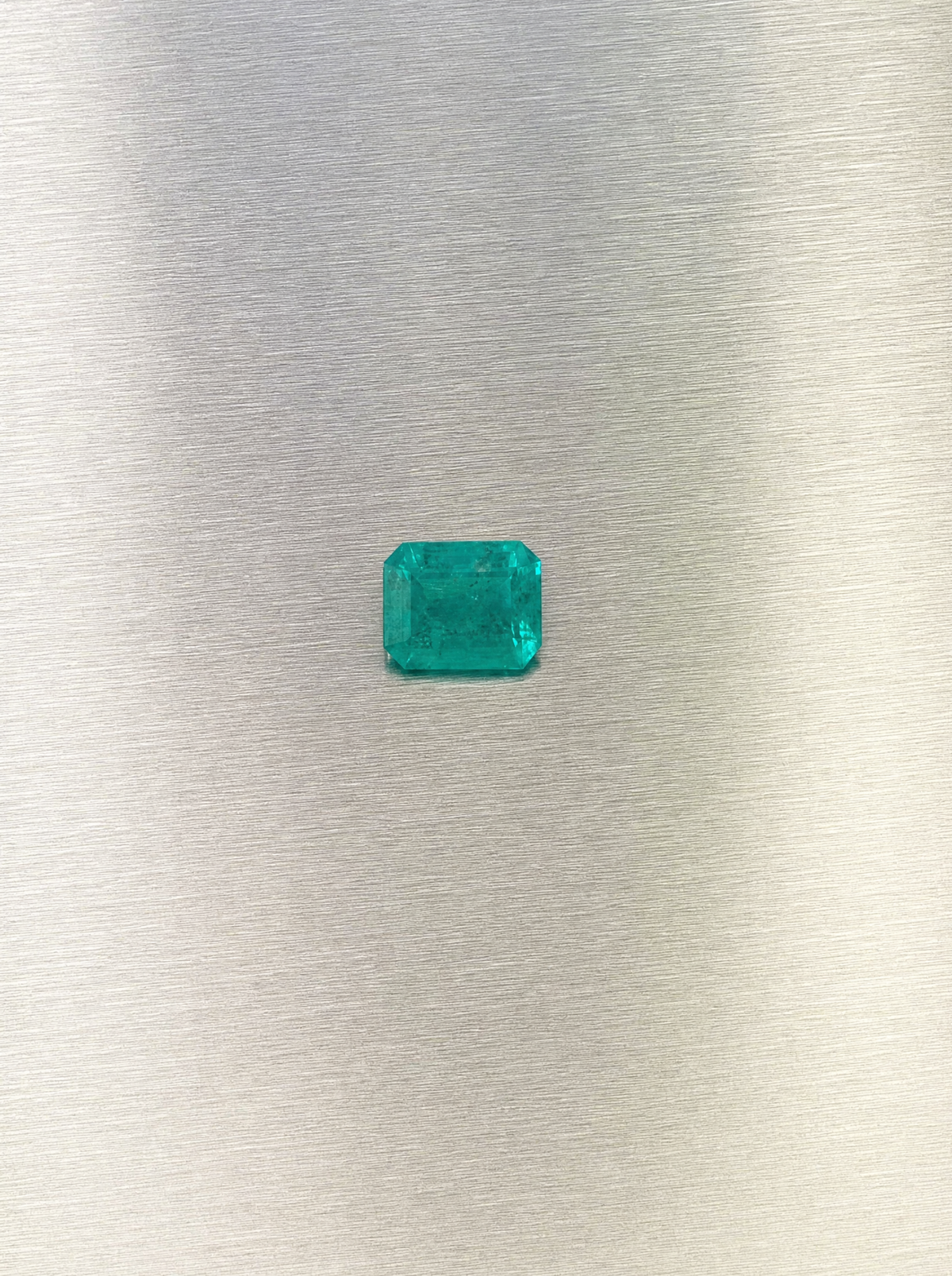 0.51 ct natural Muzo Colombian emerald, face-up view of rectangular step cut