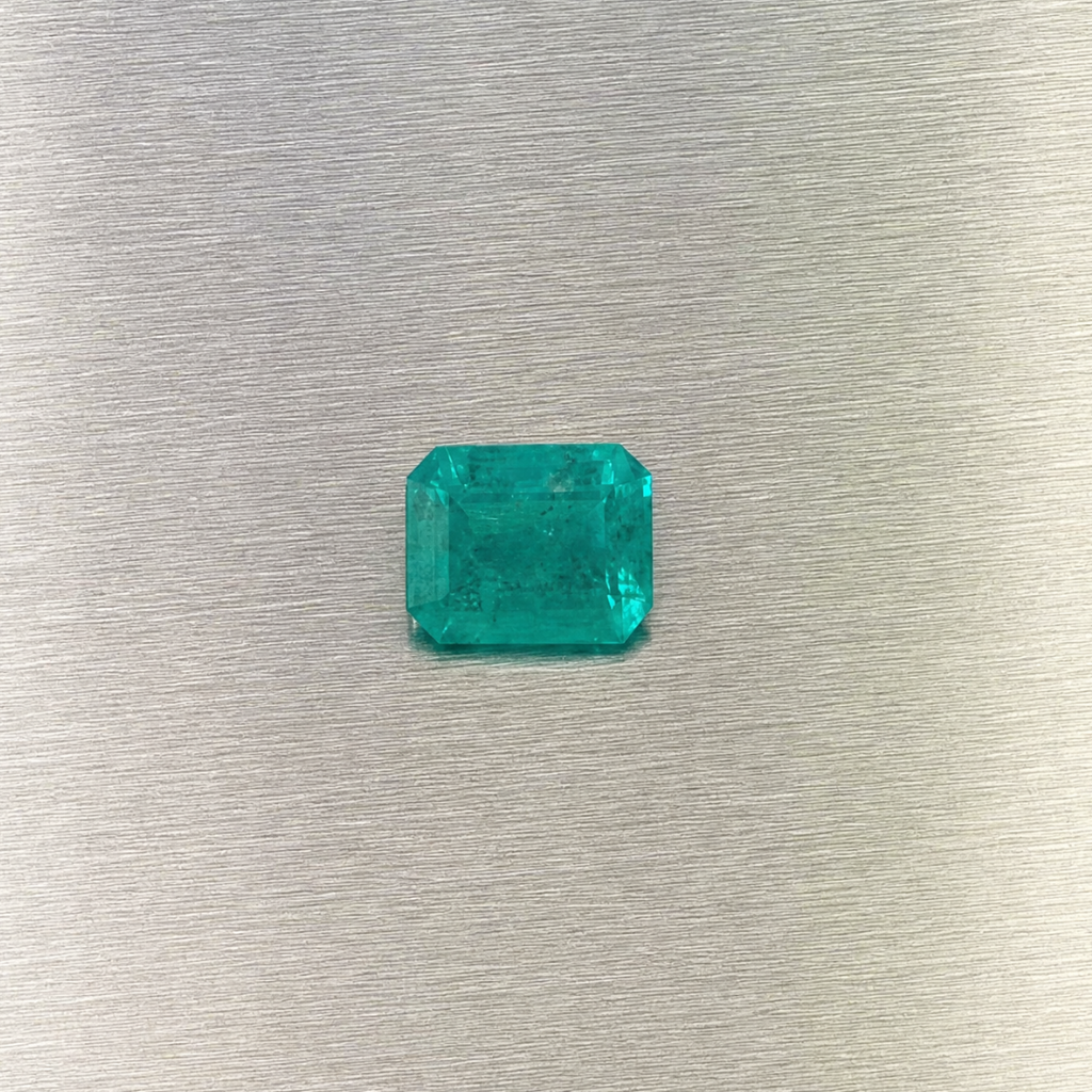 0.51 ct natural Muzo Colombian emerald, face-up view of rectangular step cut