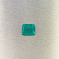 0.51 ct natural Muzo Colombian emerald, face-up view of rectangular step cut