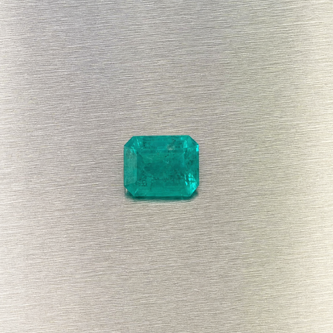 0.51 ct natural Muzo Colombian emerald, face-up view of rectangular step cut