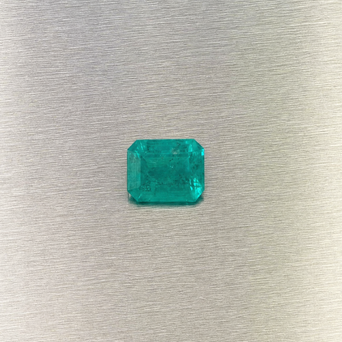 0.51 ct natural Muzo Colombian emerald, face-up view of rectangular step cut