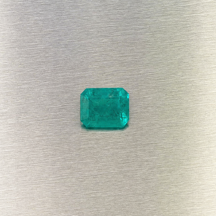 0.51 ct natural Muzo Colombian emerald, face-up view of rectangular step cut