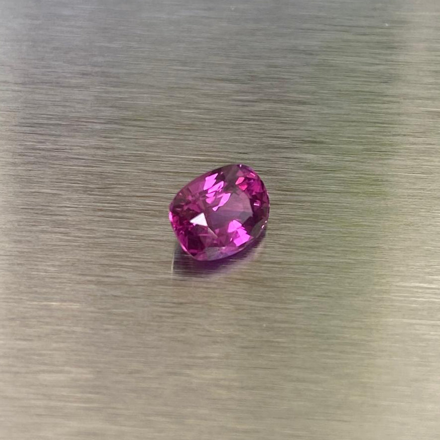 1.15 ct natural Sri Lankan ruby, angled face-up view showing pinkish red and magenta flashes