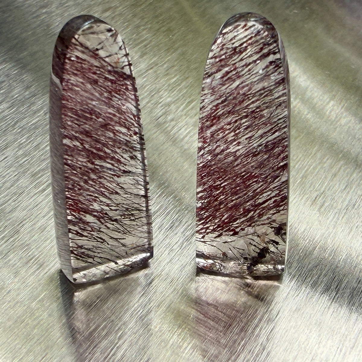 Matched pair of tourmalinated quartz obelisks with dense tourmaline inclusions, front view, Otzera OTZ-2026-00327