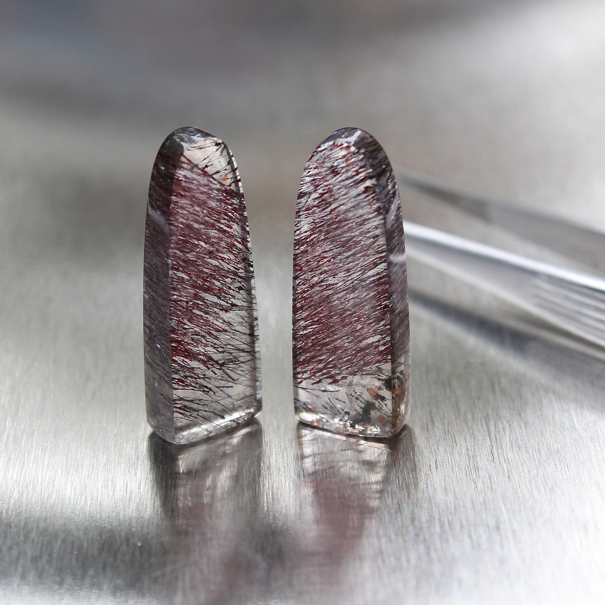 Tourmalinated quartz obelisk pair, close-up view of natural inclusions, Otzera OTZ-2026-00327