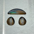 Australian boulder opal suite with matched pair and crescent cabochon, play-of-color view, Otzera OTZ-2026-00328