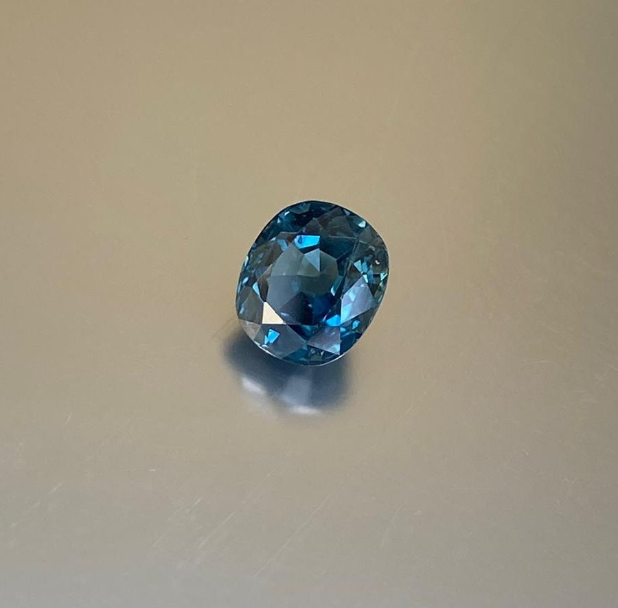 2.14 ct steel-blue cushion-cut sapphire shown from multiple angles, Otzera OTZ-2026-01625