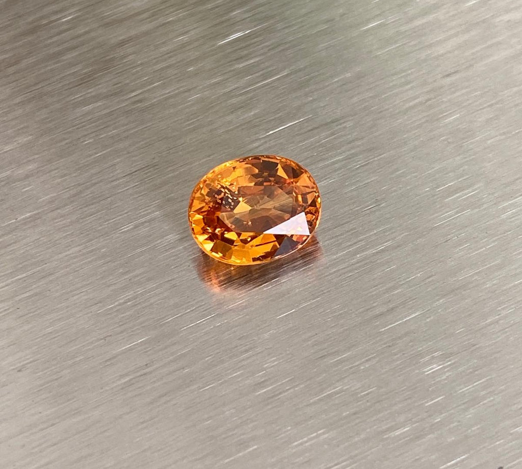 2.14 ct vivid orange oval spessartite garnet shown from multiple angles, Otzera OTZ-2026-01626