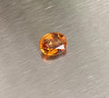2.14 ct vivid orange oval spessartite garnet shown from multiple angles, Otzera OTZ-2026-01626