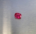 1.63 ct vivid red oval spinel shown from multiple angles, Otzera OTZ-2026-01629