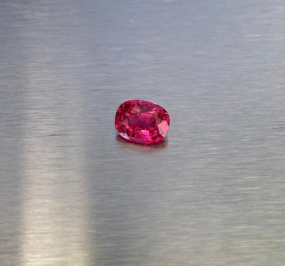 1.63 ct vivid red oval spinel shown from multiple angles, Otzera OTZ-2026-01629
