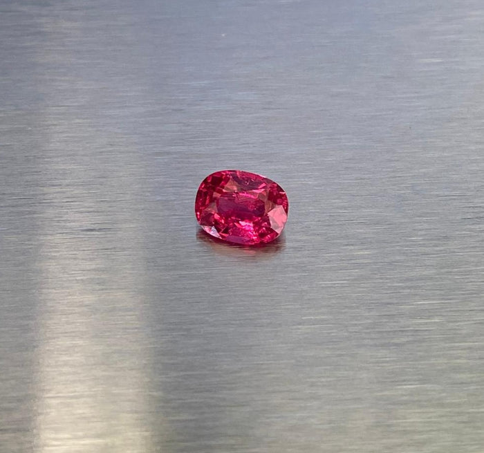1.63 ct vivid red oval spinel shown from multiple angles, Otzera OTZ-2026-01629