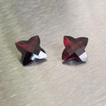 9.51 ctw matched pair of deep red custom-cut almandite garnets with four-point checkerboard-style crowns, Otzera OTZ-2026-01634