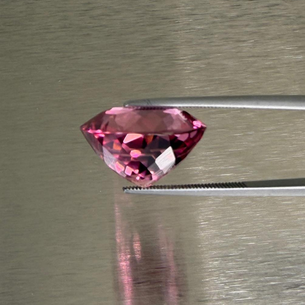 23.58 ct natural pink tourmaline in side profile showing cushion modified brilliant proportions, Otzera OTZ-2026-01635