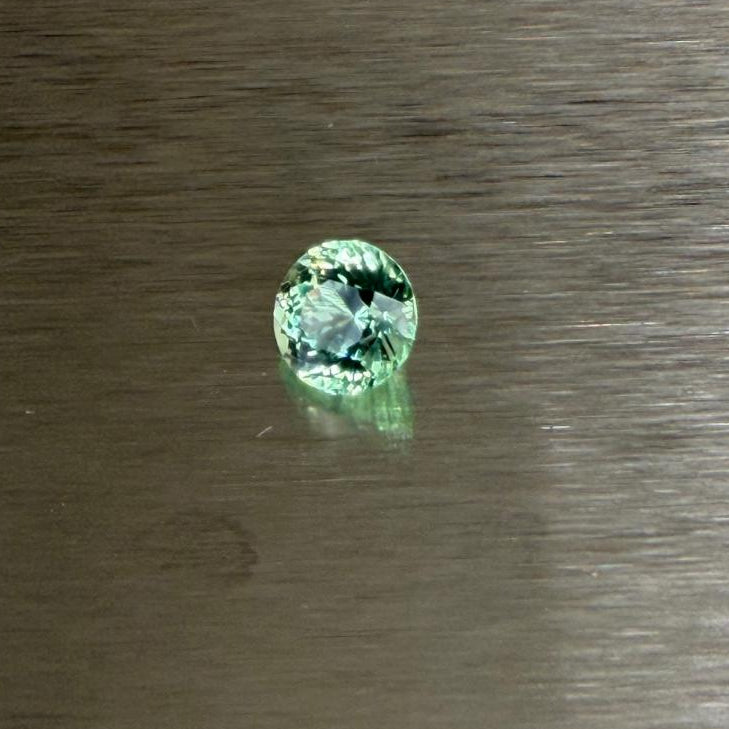 1.70 ct Merelani mint grossular garnet at an angled view showing lively brilliance, Otzera OTZ-2026-01636