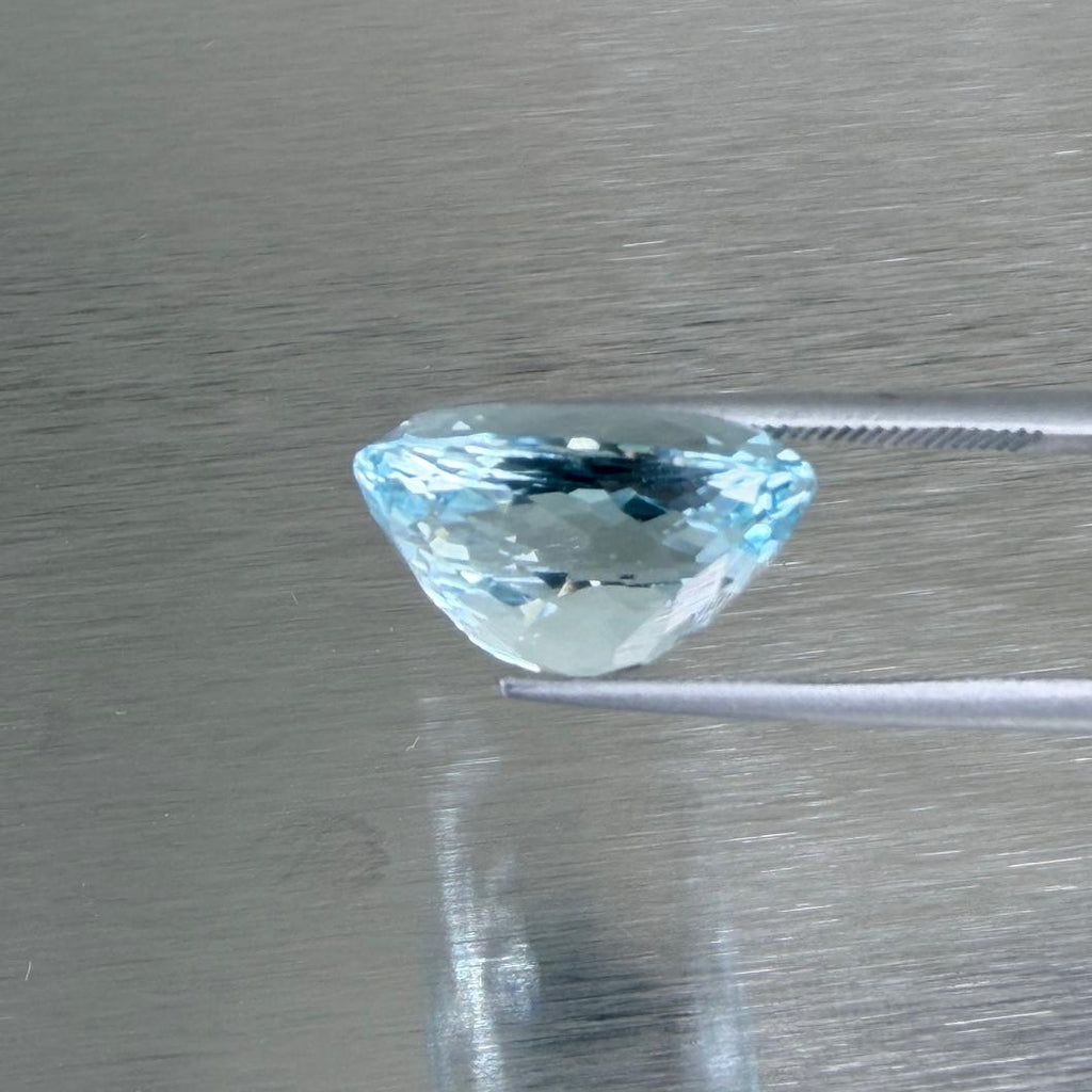 9.05 ct natural Nigerian aquamarine in a cushion modified brilliant cut, shown from multiple angles, Otzera OTZ-2026-01638