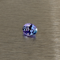 1.57 ct natural purple sapphire oval modified brilliant face-up on brushed metal