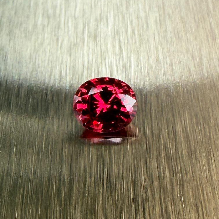 0.79 ct natural red spinel from Myanmar in an oval mixed cut, shown from multiple angles, Otzera OTZ-2026-01645