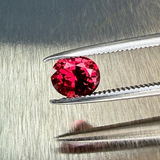 0.79 ct natural red spinel from Myanmar in an oval mixed cut, shown from multiple angles, Otzera OTZ-2026-01645