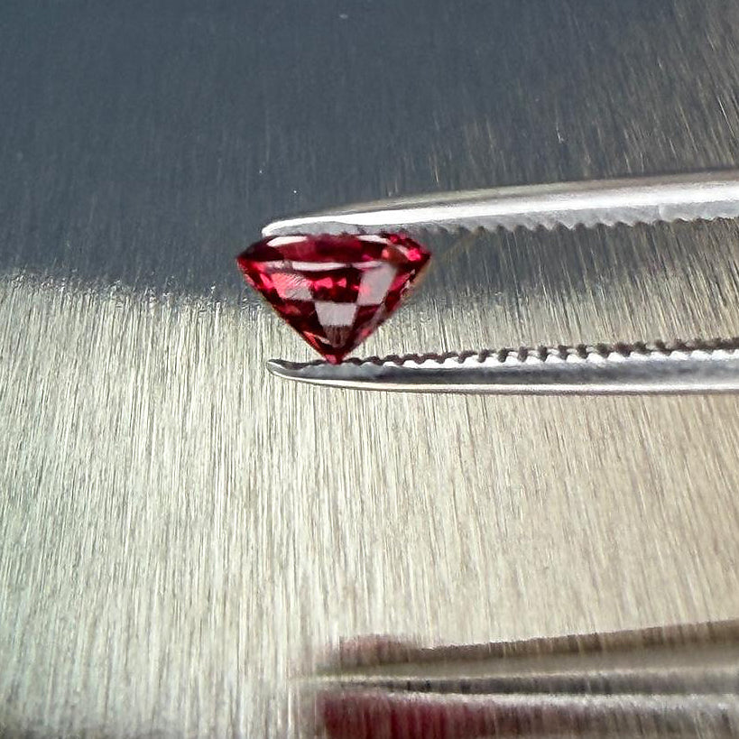 0.79 ct natural red spinel from Myanmar in an oval mixed cut, shown from multiple angles, Otzera OTZ-2026-01645