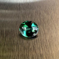 2.98 ct natural blue-green tourmaline from Namibia in an oval buff top modified brilliant cut, shown from multiple angles, Otzera OTZ-2026-01646