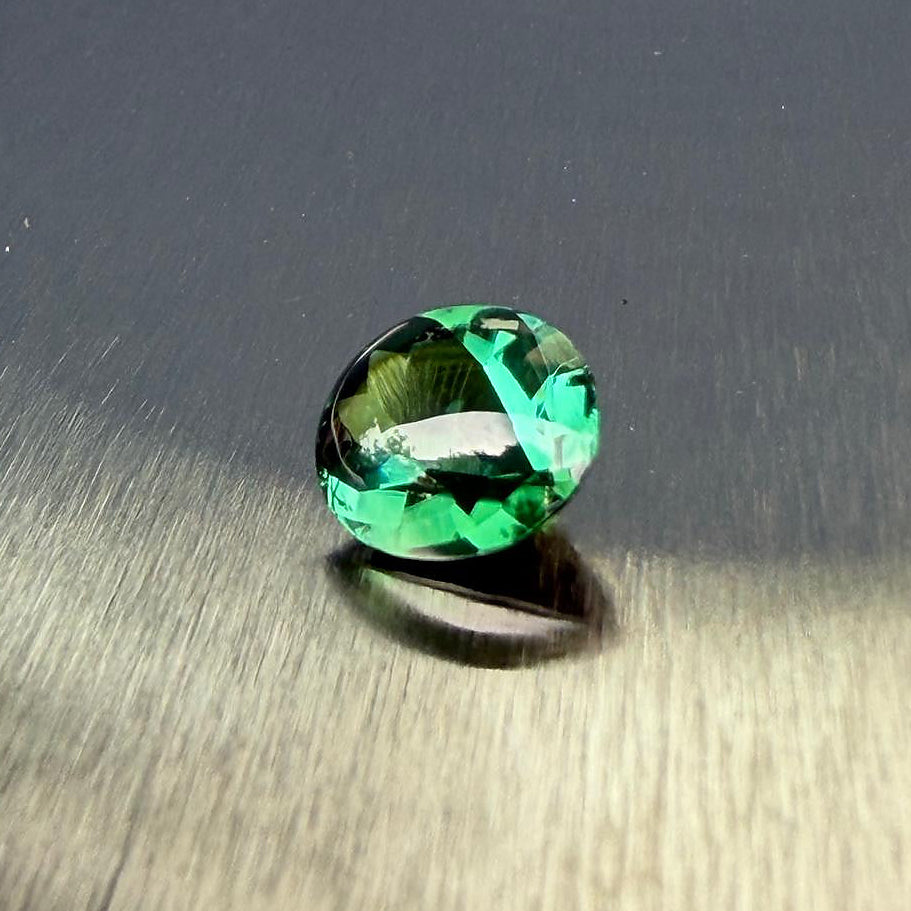 2.98 ct natural blue-green tourmaline from Namibia in an oval buff top modified brilliant cut, shown from multiple angles, Otzera OTZ-2026-01646