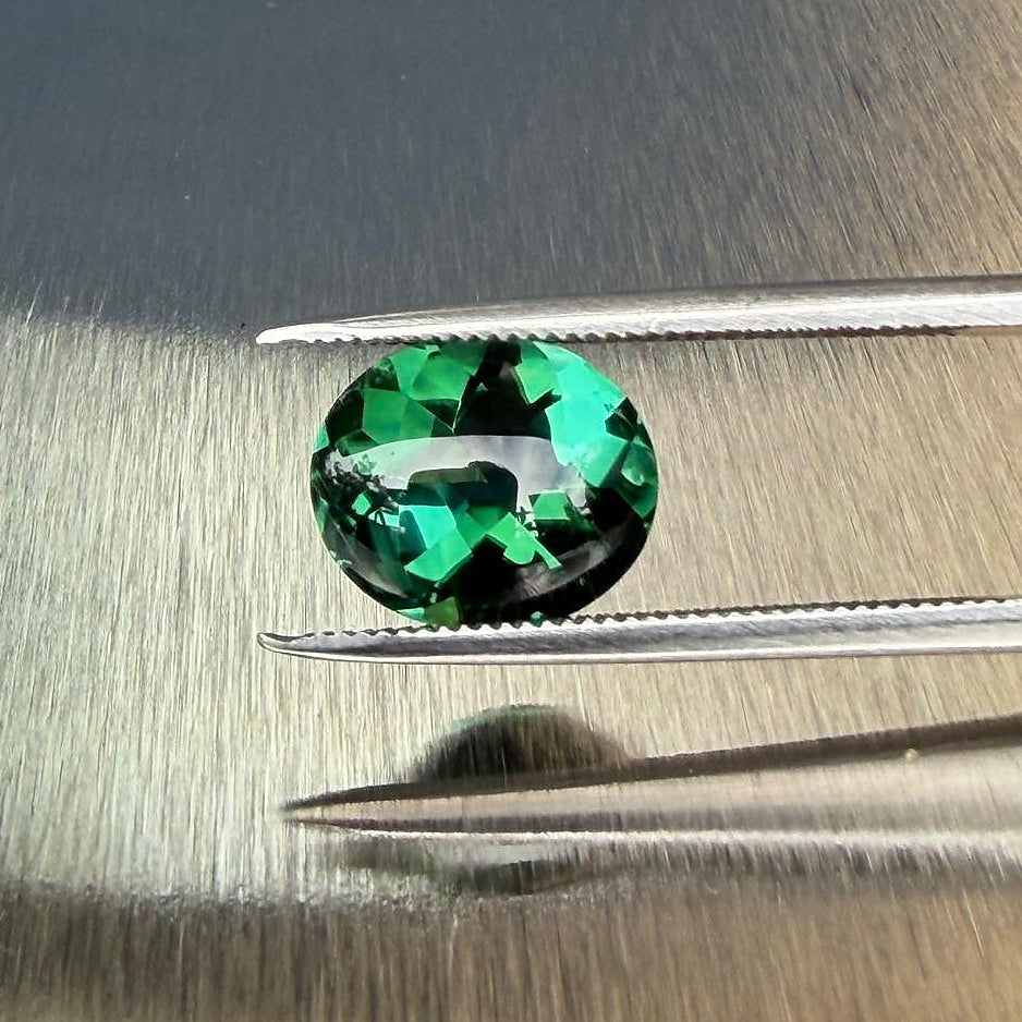 2.98 ct natural blue-green tourmaline from Namibia in an oval buff top modified brilliant cut, shown from multiple angles, Otzera OTZ-2026-01646
