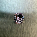 1.28 ct natural purple spinel from Vietnam in a round brilliant cut, shown from multiple angles, Otzera OTZ-2026-01647