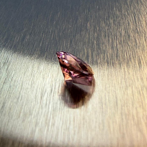 1.28 ct natural purple spinel from Vietnam in a round brilliant cut, shown from multiple angles, Otzera OTZ-2026-01647