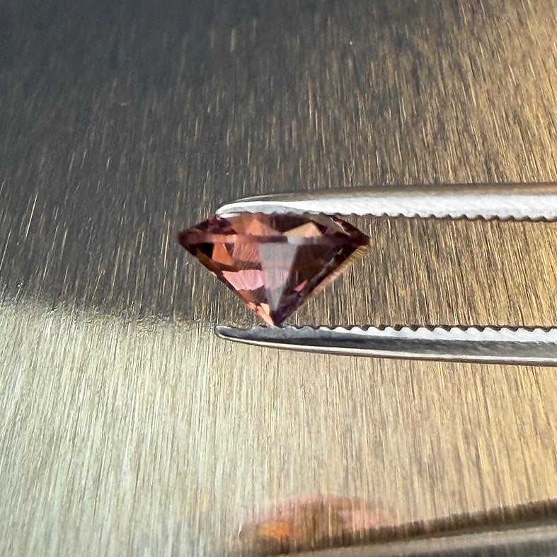 1.28 ct natural purple spinel from Vietnam in a round brilliant cut, shown from multiple angles, Otzera OTZ-2026-01647