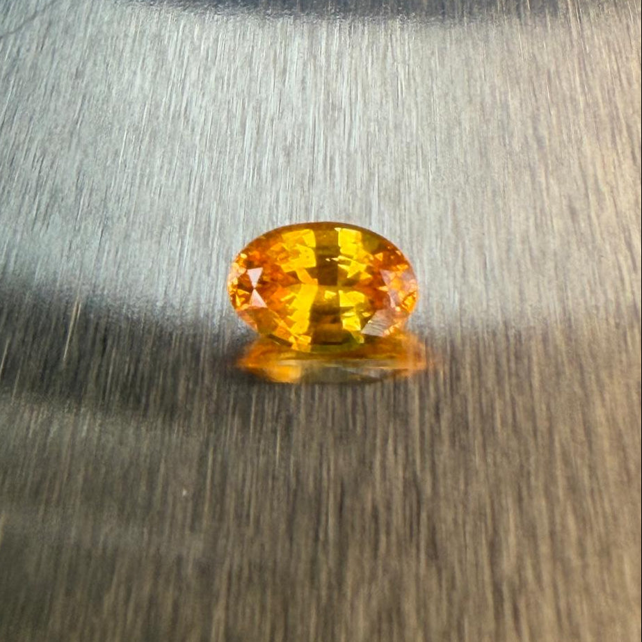 1.38 ct natural yellow sapphire from Sri Lanka in an oval mixed cut, face-up view, Otzera OTZ-2026-01648