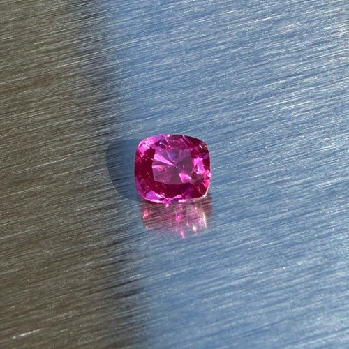 1.40 ct heated natural ruby from Vietnam, cushion mixed cut, face-up view