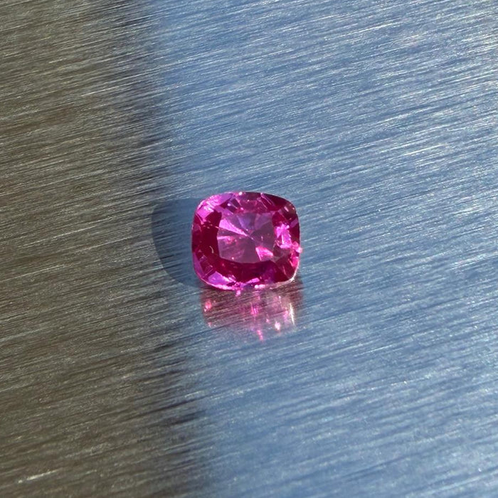 1.40 ct heated natural ruby from Vietnam, cushion mixed cut, face-up view