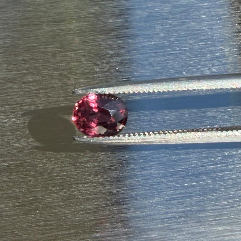 1.00 ct unheated natural ruby, oval mixed cut, face-up view in sunlight, Otzera OTZ-2026-01655