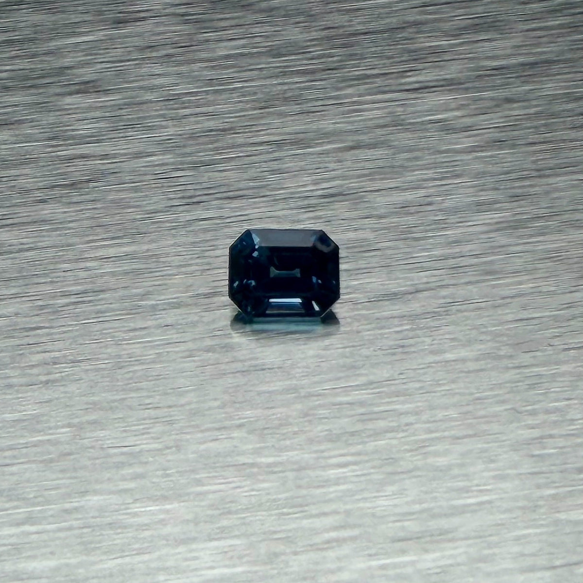 1.00 ct heated natural blue sapphire, emerald cut, face-up view, Otzera OTZ-2026-01660
