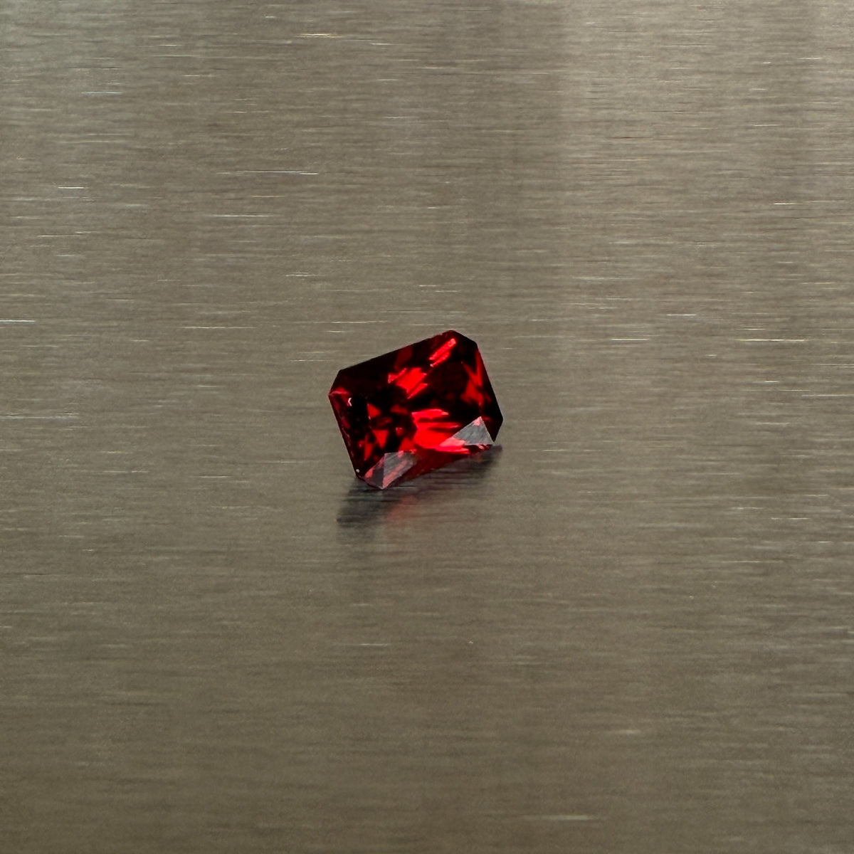 2.18 ct precision-cut Nigerian spessartite garnet, alternate view showing saturated red-orange color, Otzera OTZ-2026-01668