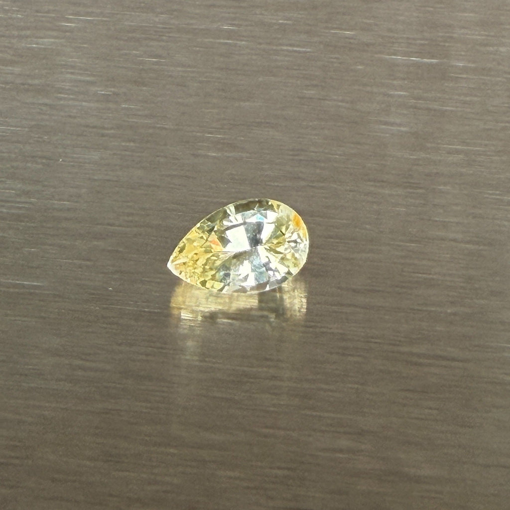 1.24 ct unheated Ceylon yellow sapphire, pear mixed cut, face-up view, Otzera OTZ-2026-01671