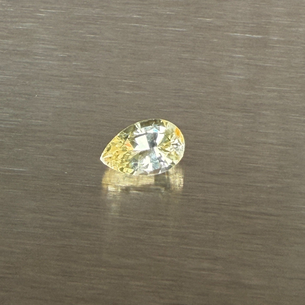 1.24 ct unheated Ceylon yellow sapphire, pear mixed cut, face-up view, Otzera OTZ-2026-01671