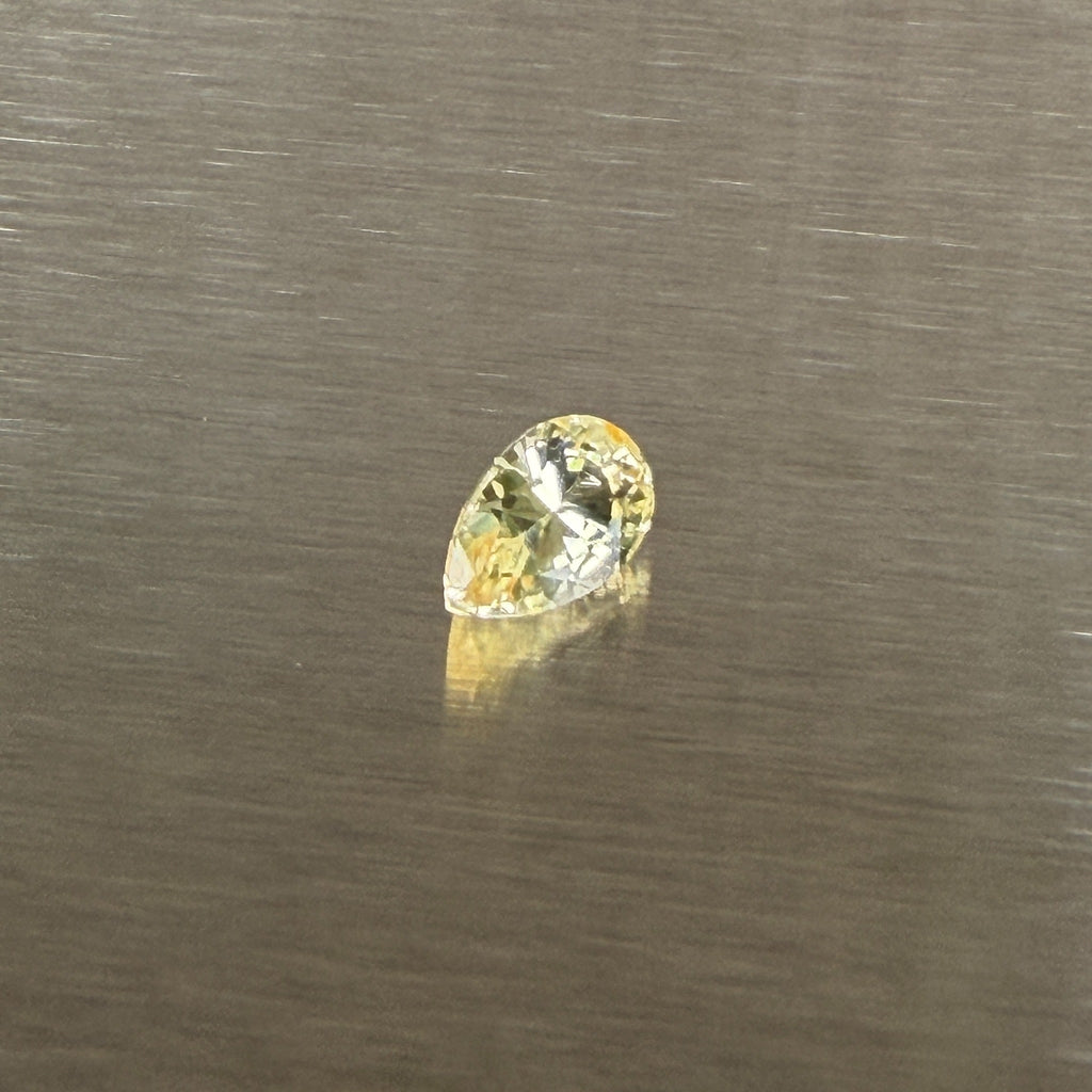 1.24 ct unheated Sri Lankan yellow sapphire, alternate face-up pear view, Otzera OTZ-2026-01671
