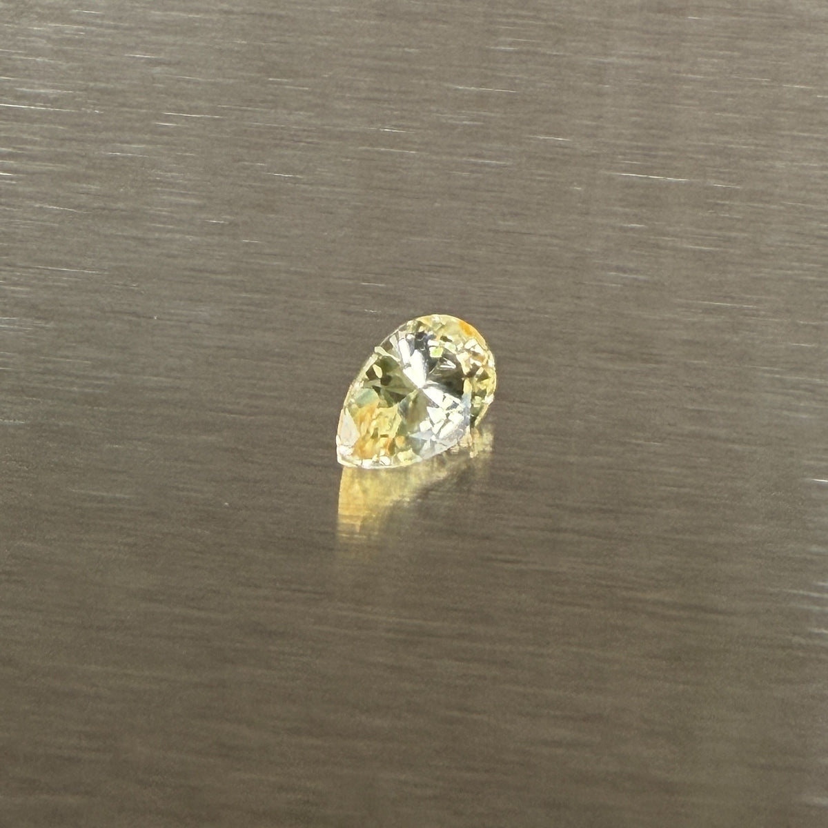 1.24 ct unheated Sri Lankan yellow sapphire, alternate face-up pear view, Otzera OTZ-2026-01671