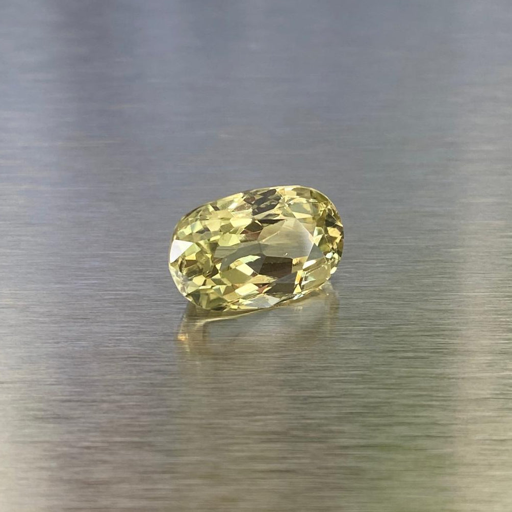 3.83 ct natural yellow chrysoberyl, angled oval view showing the antique modified brilliant cut.